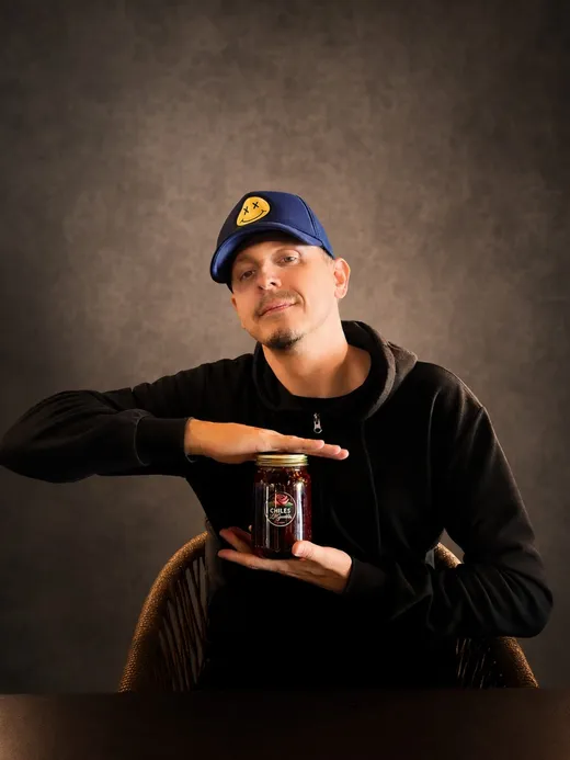 Holding a jar of Chiles La Güerita